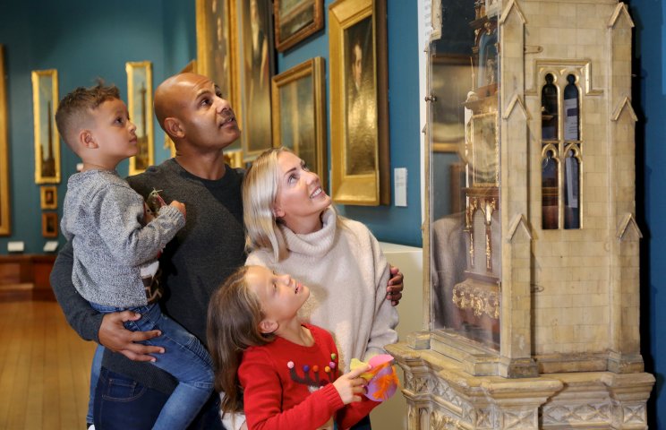 Image: A family looking at the Lichfield Clock