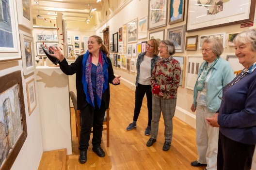 Image: A group having a tour of a temporary exhibition