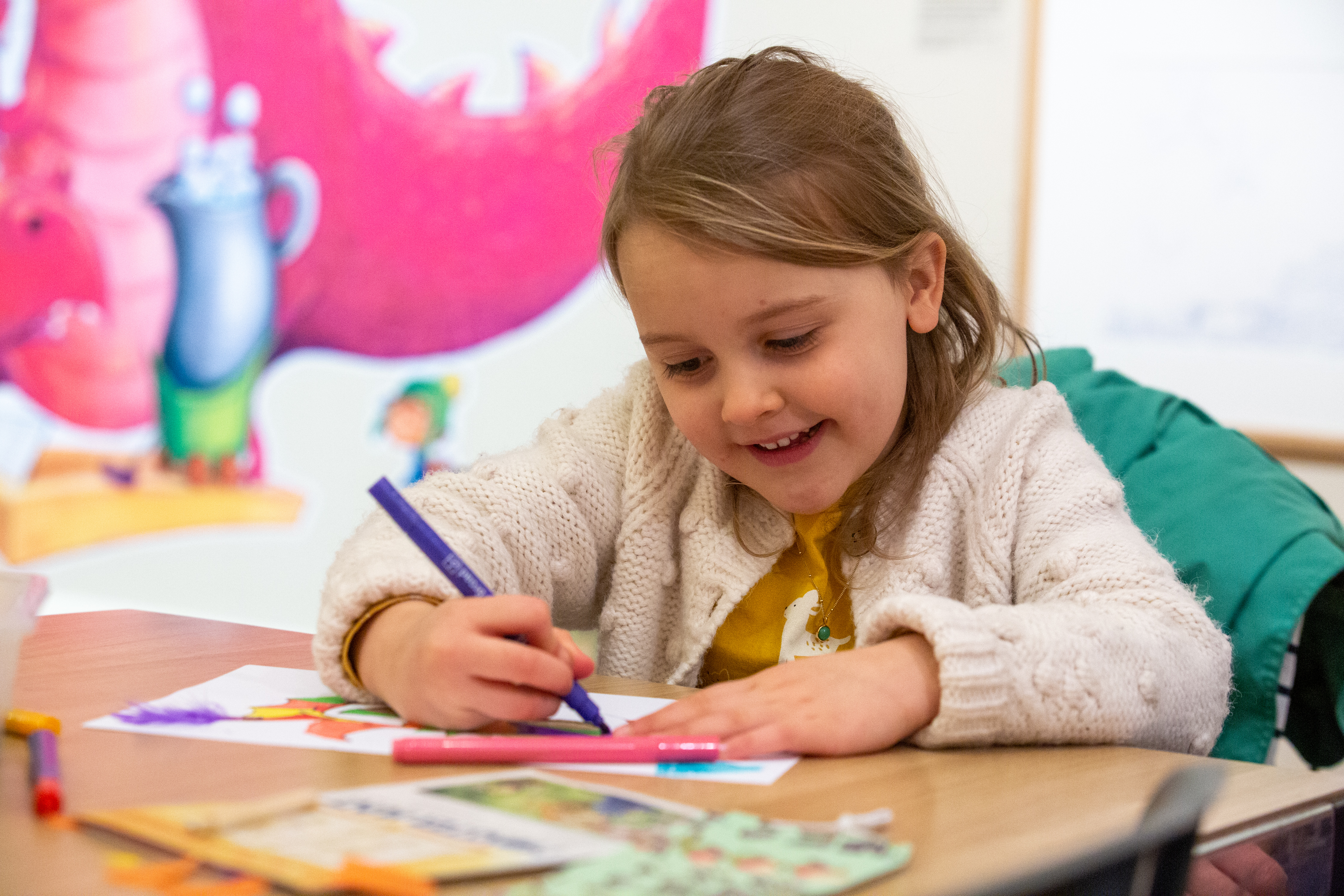 Image: A child taking part in a craft activity