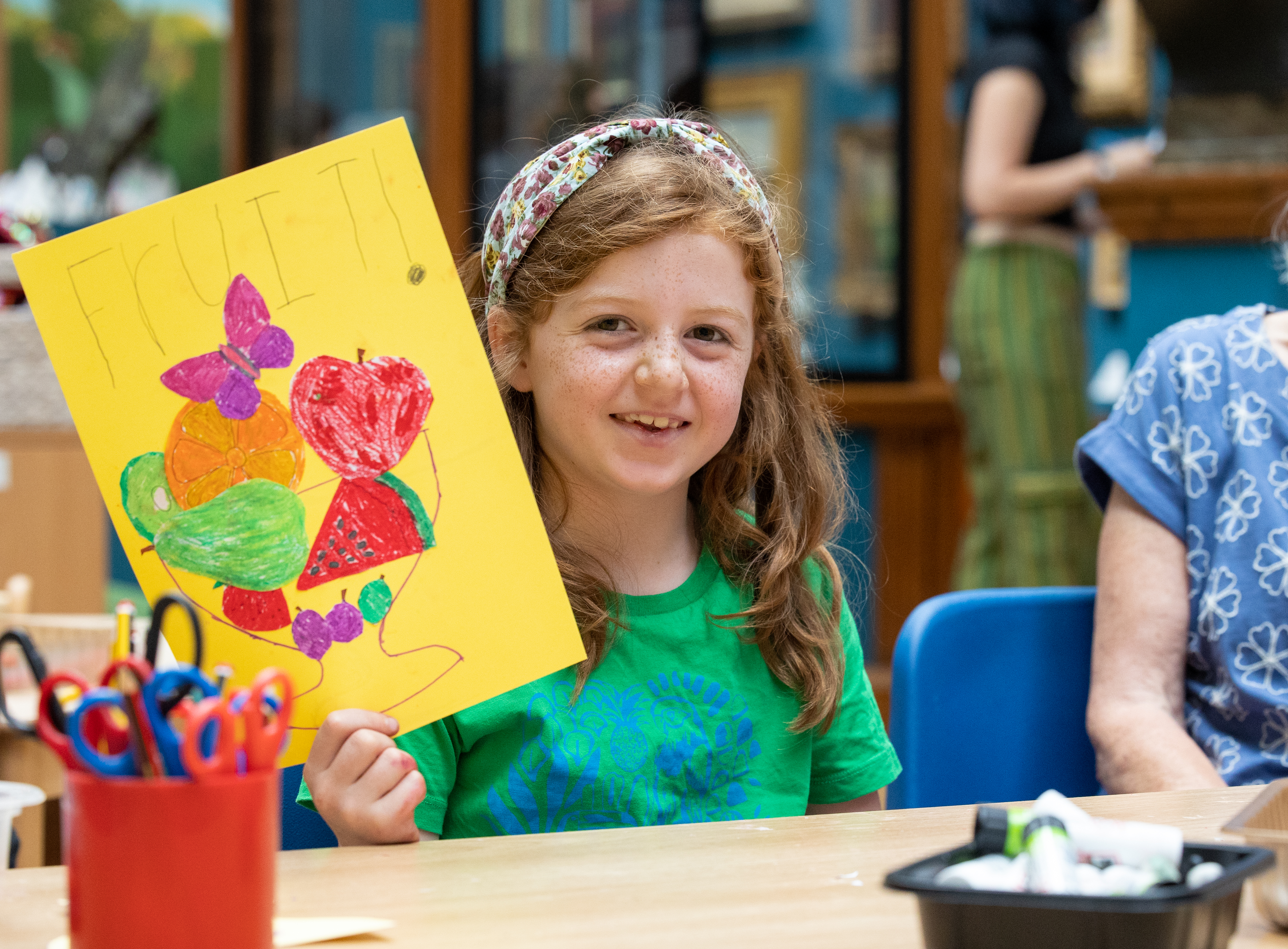 Image: A child taking part in a craft activity