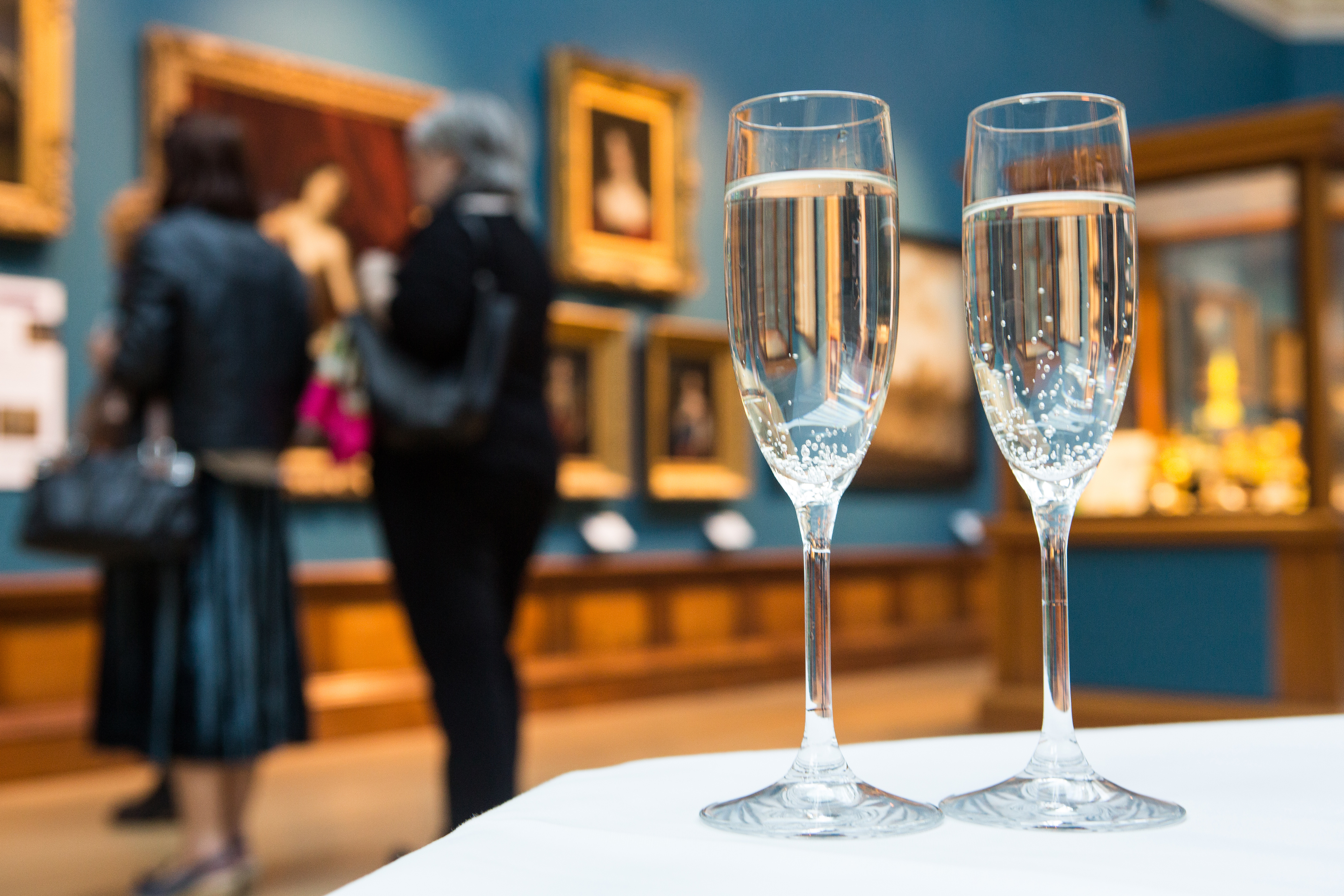 Glasses of fizz on a table in the Upper Gallery