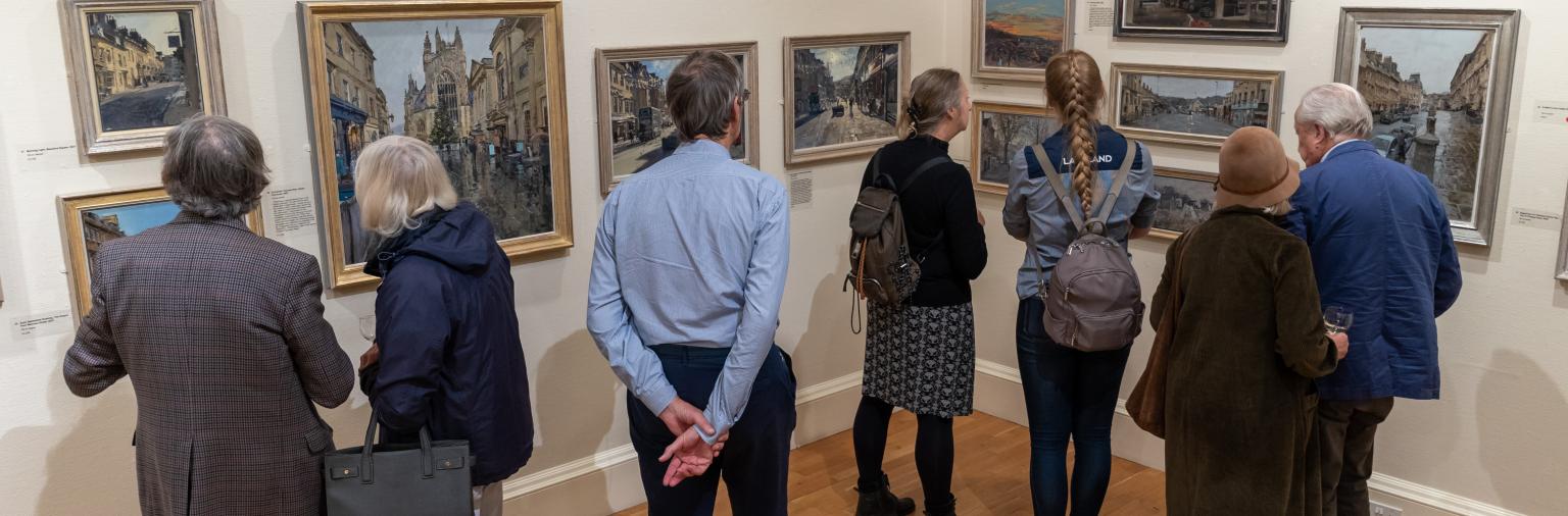 Image: A group of people viewing an exhibition