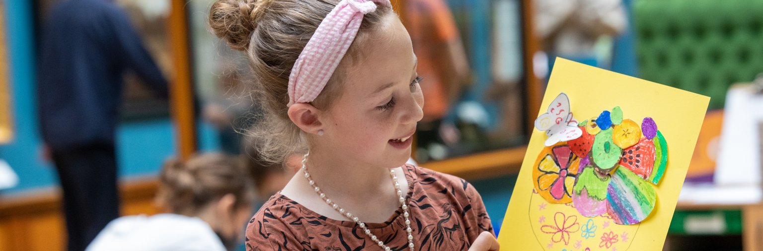 Image: A child taking part in a craft activity