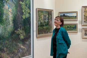 Image: A visitor viewing artworks