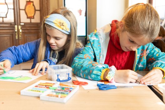 Two young girls doing arts and crafts